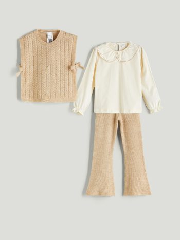 Three-piece set consisting of trousers, a blouse, and a knitted jacket