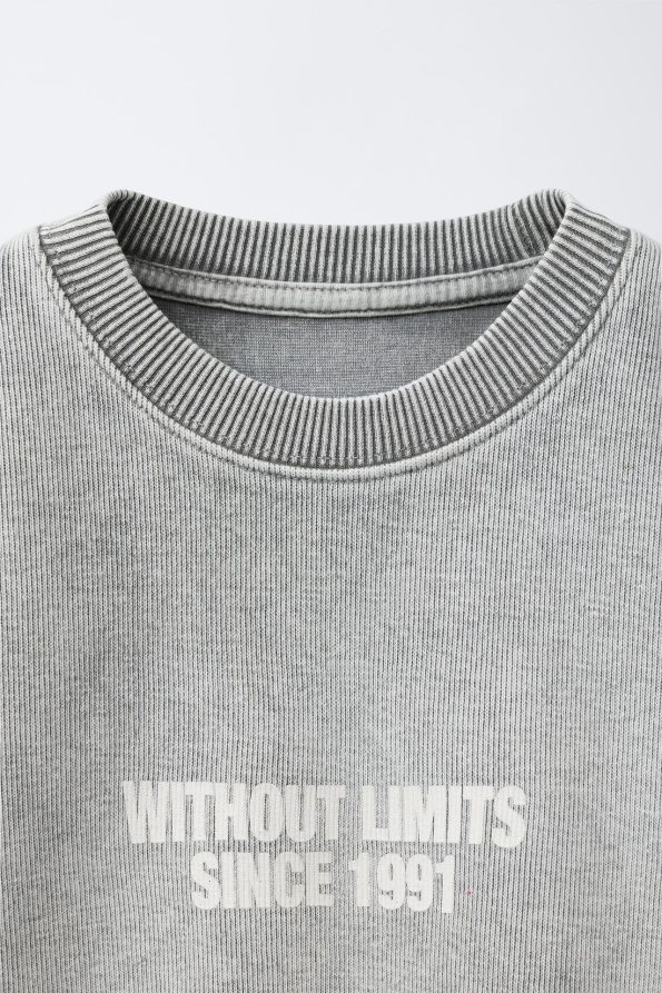 Faded Effect Slogan Sweatshirt