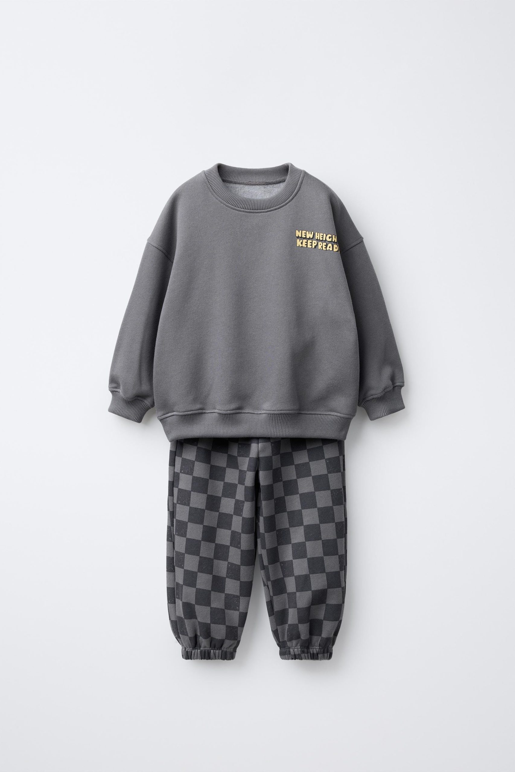 6426eb7b-05ab-4830-bca0-eb247f8e8128-75ac-4.jpg Boys' Cotton Charcoal Checkered Tracksuit - New Heights Detail