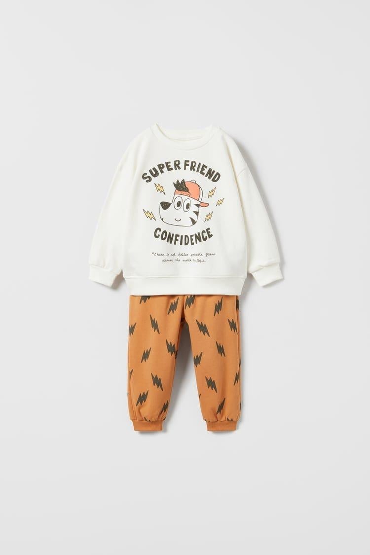 a6c12db7-d8b8-4216-814b-027f3446f3c1-637d1a.jpg Boys' Cotton Ecru Dog Print Sweatshirt and Orange Patterned Tracksuit Set