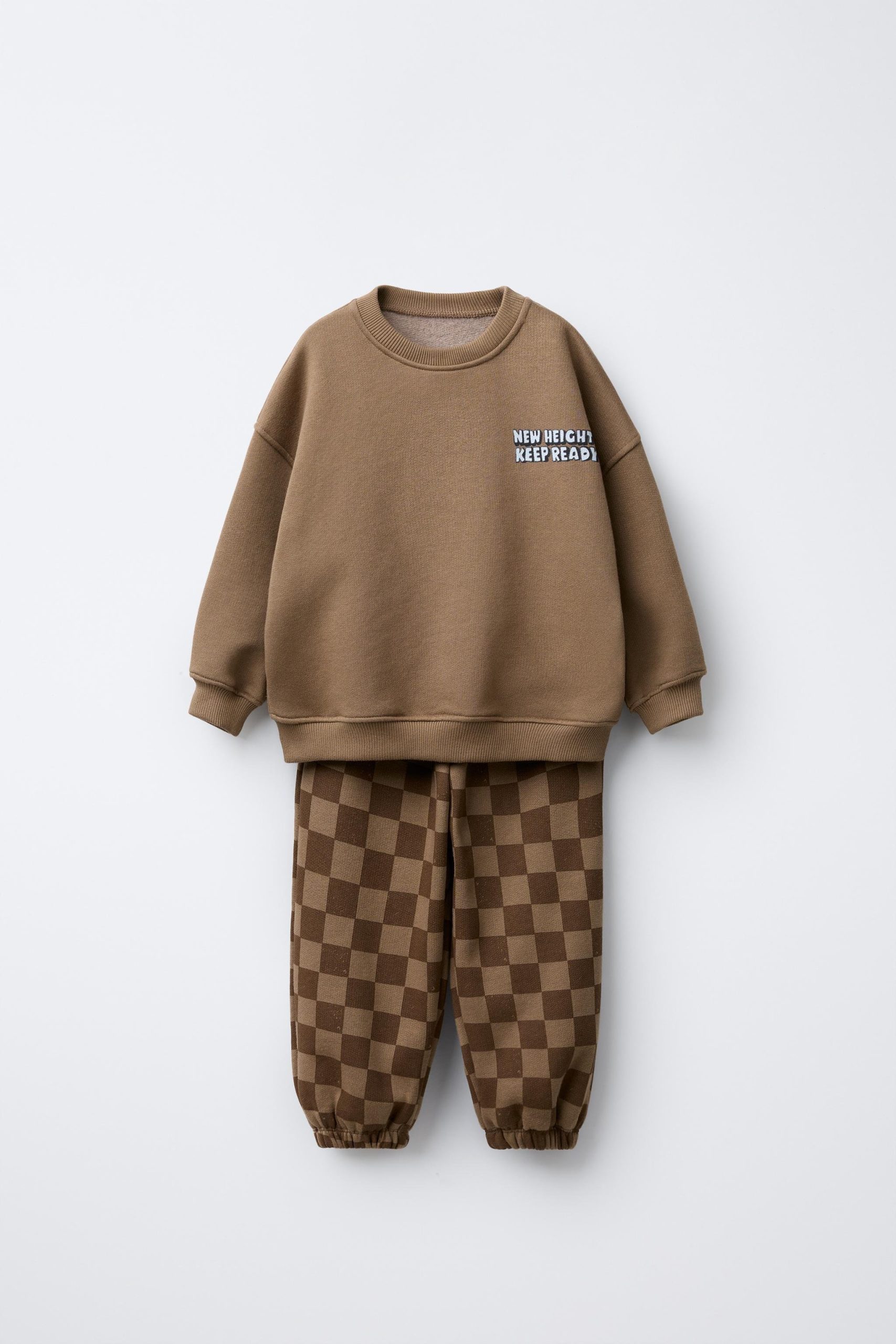 cafe80f1-c64c-449e-b3cc-e8247c5c9929-c-5e1c.jpg Boys' Brown Cotton Checkered Tracksuit with New Heights Detail