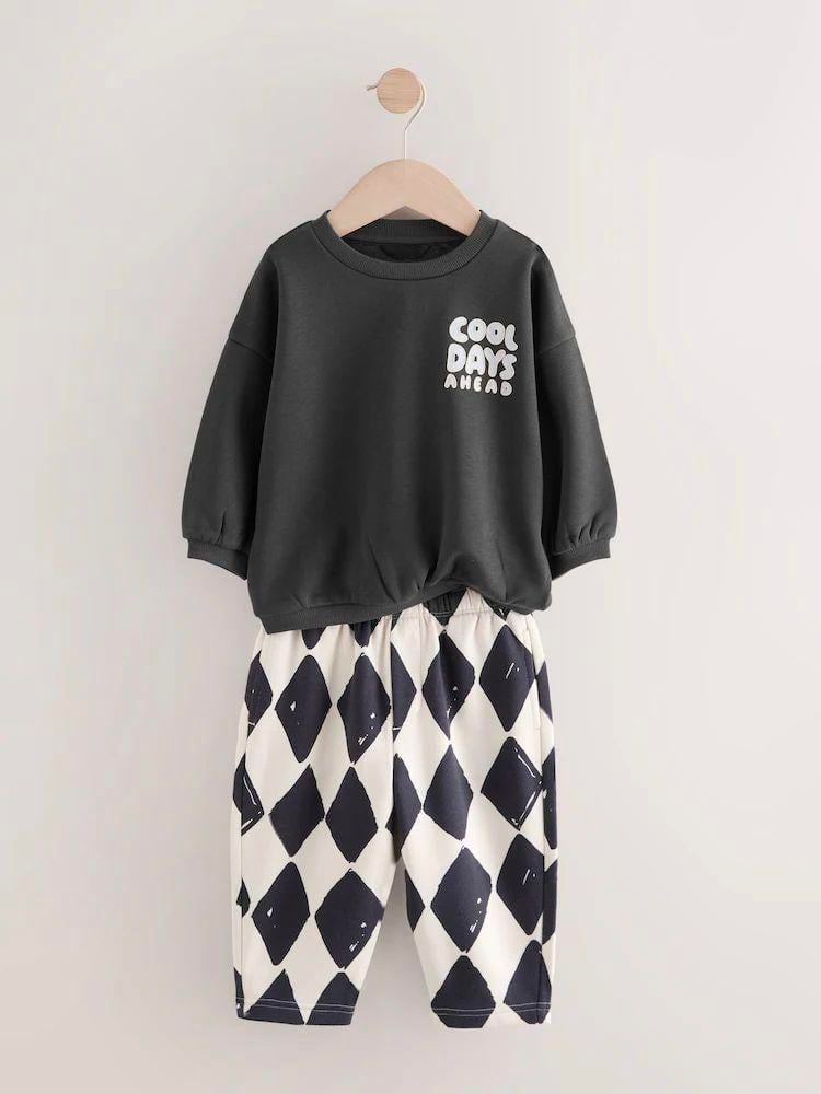 e6fc4bee-d2b6-4dd9-b2eb-97d52f64869c-4815a7.jpeg Unisex Kids Cotton Black Printed Sweatshirt and Patterned Bermuda Set
